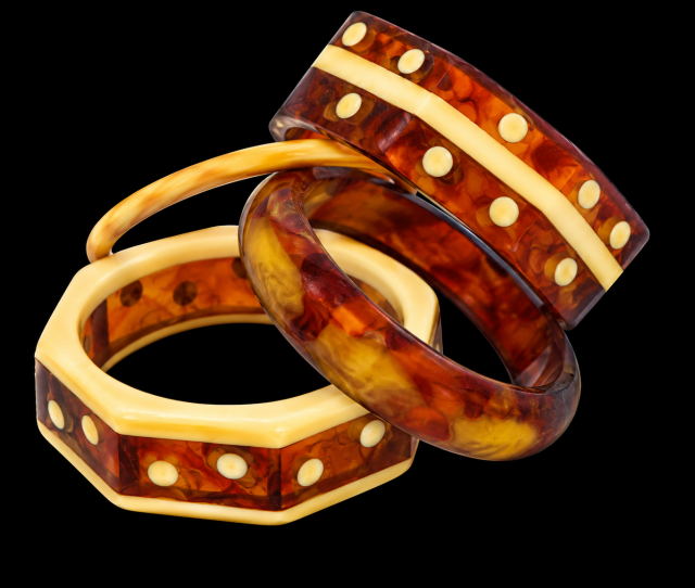 Two Shultz octagon bangles in laminated custard and tortoise bakelite with custard dots